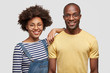 © Wayhome Studio - Horizontal shot of pleased young African American man and woman have gentle smiles, show good relationships, have pleasant talk together, feels support from each other, isolated on white background
