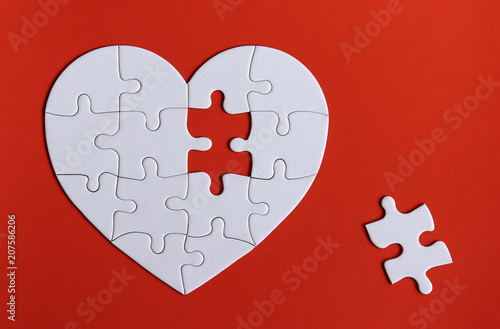 A missing piece of the puzzle and A red heart with a puzzle piece missing