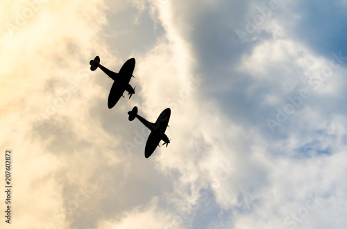 Fotografía Two silhouetted spitfires dive out of the bright sun, as if attacking an enemy with surprise