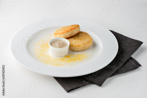 Fried Meat Cutlets With Sauce And Decoration On White Plate