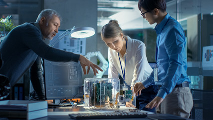 Team of engineers working in computer science research lab