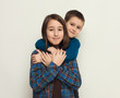 © Prostock-studio - Happy brother and sister, studio background