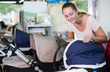 © JackF - female choosing pram for newborn