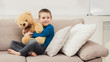 © Prostock-studio - Little cute child with Teddy bear at living room