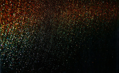 Wall Mural - red sparkling and shining star points on a black isolated background and a blue bright flash will cr