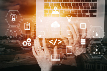 Fototapete - cyber security internet and networking concept.Businessman hand working with VR screen padlock icon mobile phone on laptop computer background with buildings exposure