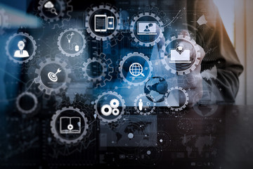 businessman hand working with modern technology and digital layer effect as business strategy concep