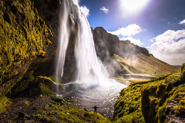  Seljalandsfoss - May 04, 2018: Traveler at the Seljalandsfoss waterfall, Iceland