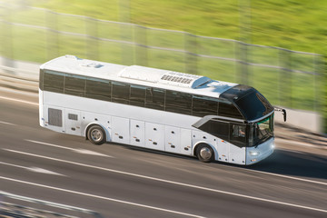 Wall Mural - Tourist bus speeding on highway, blured in motion.