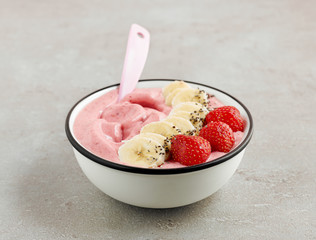 Wall Mural - smoothie bowl of frozen banana and strawberries