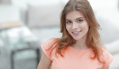 Wall Mural - closeup portrait of a young woman on blurred background.