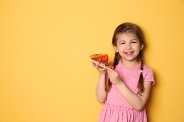 Cute little girl with slice of pizza on color background