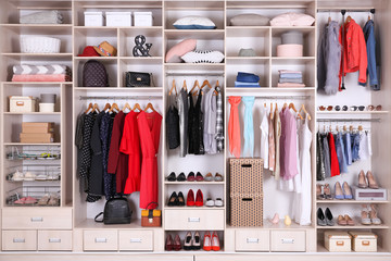 Wall Mural - Large wardrobe with different clothes, home stuff and shoes