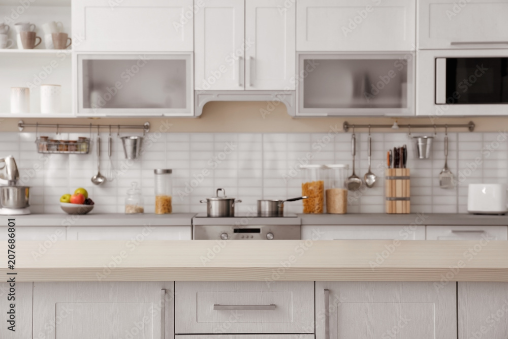 Countertop and blurred view of kitchen interior on background - obrazy, fototapety, plakaty 