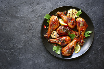 Wall Mural - Roasted spicy chicken legs.Top view with copy space.