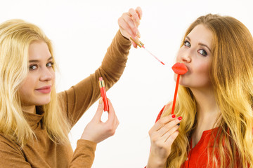 Wall Mural - Two women and lip product