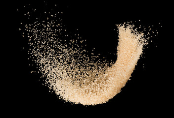 Brown sugar splash isolated on black background  ,throwing freeze stop motion element food and drink object design