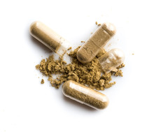 Herbal Medicine Powder In Capsule On White Background