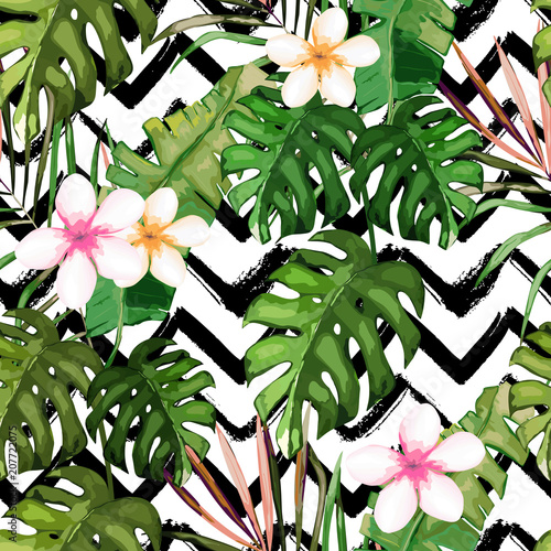 Tropical seamless pattern. Palm tree leaves and flower. Hand drawn vector ill...