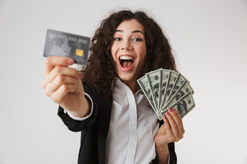 Poster - Excited happy young business woman with credit card and money.