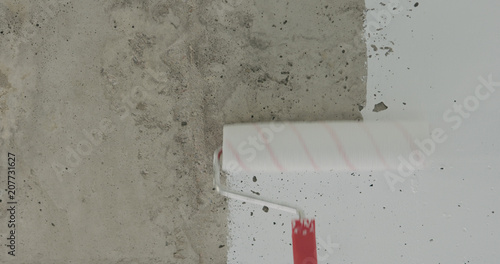 Painting Concrete Ceiling Into White With Roller This Stock Painting Concrete Ceiling Into White With Roller