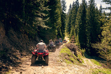 A Tour Group Travels On ATVs And UTVs On The Mountains