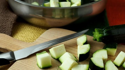 Canvas Print - Healthy chopped zucchini on a cutting board with knife