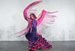 © Carlos Moron Villar/ADDICTIVE STOCK - Flamenco dancer in action with the typical Spanish dance costume.