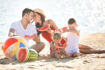 Wall Mural - Cheerful family on the beach. Family on vacation