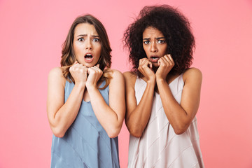 Poster - Two scared young girls dressed in summer clothes