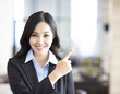 © Tom Wang - young asian business woman pointing