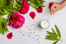 Beautiful Flat Lay With A Candle And Flowers Peonies. Top View, White Background