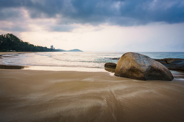 Canvas Print - Sea rocks with dramatic sky on sunrise