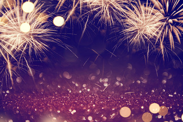 Gold and dark Fireworks and bokeh in New Year eve and copy space. Abstract background holiday.