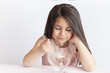 © kaganskaya115 - Happy child girl eating ice cream in white and chocolate bowl on white background. Enjoying delicious.