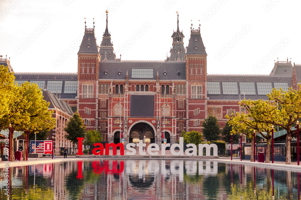 The sign i amsterdam in front of rijksmuseum in Amsterdam on sunrise - obrazy, fototapety, plakaty 