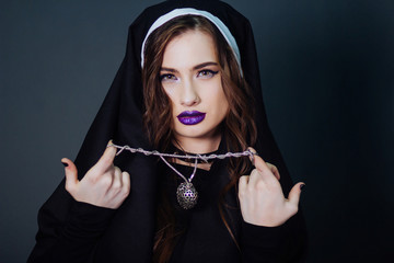 Beautiful girl in the image of a nun. Sexual model. The image for Halloween