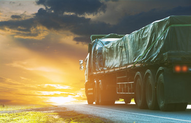 Trailer, trucks on an asphalt road in a rural for transportation concept..