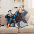 © Prostock-studio - Frightened children watching TV at home