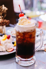 Sweet Refreshing Cherry Cola Topping With A Scoop Of Vanilla Ice Cream And Fresh Cherry.