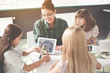 © Yakobchuk Olena - Satisfied kid playing with contemporary robot. Beaming lady and friends looking at her in classroom. Modern digital device concept
