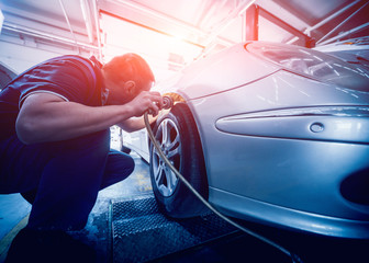 Wall Mural - Automotive suspension test and brake test rolls in a auto repair service.