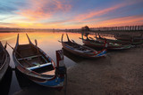 Fototapeta Zachód słońca - Beautiful scenery during sunset of marina at U-Bein bridge with colorful sky at Mandalay in Myanmar. This is a very popular for photographers and tourists. Attractions and transportation Concept.