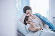© Photographee.eu - Mother taking care of sick daughter with oxygen mask and teddy bear