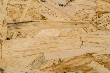 Wall Mural - surface texture of oriented strand board (OSB), Wood board made from piece of wood