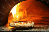 Fototapeta  - Neapolitan pizza in a wood stove
