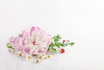 Poster - Bouquet of beautiful flowers on white wooden background. Top view. Copy space