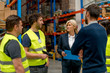 © Stock Rocket - Supervisor talking with staff in warehouse