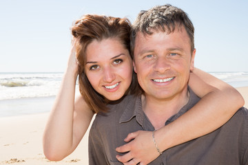 Young couple having fun at the beach