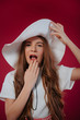 © ZoomStudio - Fashion concept - portrait of a beautiful little girl in big hat.Teenager girl wearing big summer hat.Broad-brimmed hat.